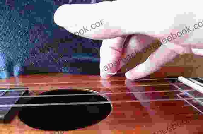 Close Up Of Fingers Plucking Ukulele Strings UKULELE BEGINNER TO BRILLIANT 2: INTERMEDIATE: A COMPLETE METHOD FOR PLAYING THE UKULELE (UKULELE: BEGINNER TO BRILLIANT)