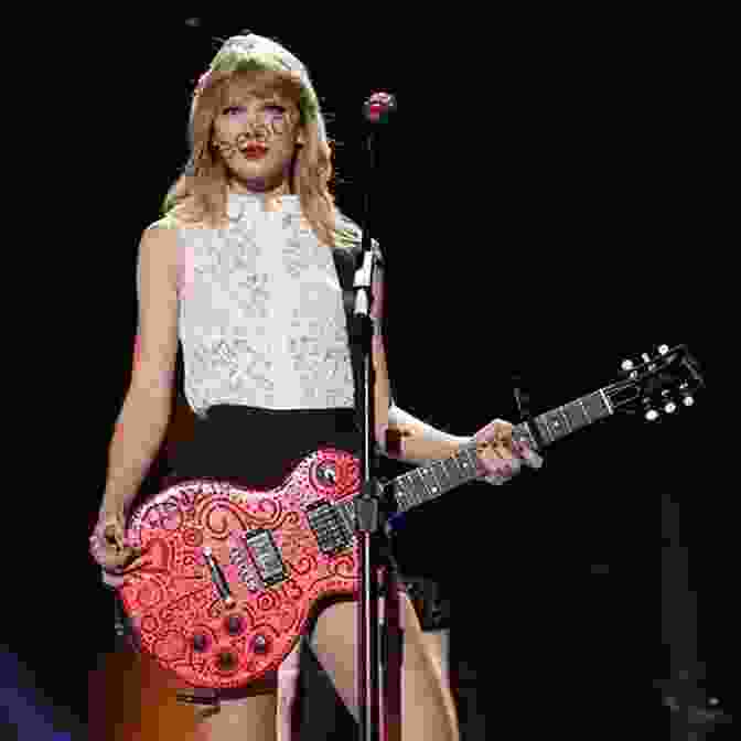 Victoria Erickson Performing Live On Stage With Her Guitar. Rhythms And Roads Victoria Erickson